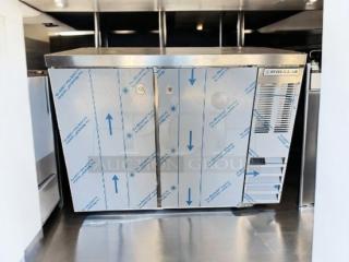 Brand new Beverage-Air 3-door underbar refrigerator in stainless steel. Pristine condition, 120V, with manufacturer protective film.