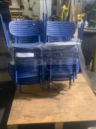 Set of blue metal stackable café chairs, pristine condition, wrapped and ready for use.