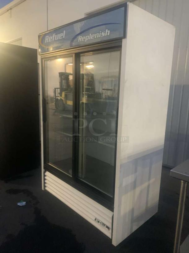 True GDM-45 double glass door merchandiser refrigerator, prime condition, 115V, fully tested, visible "Refuel" and "Replenish" signage.