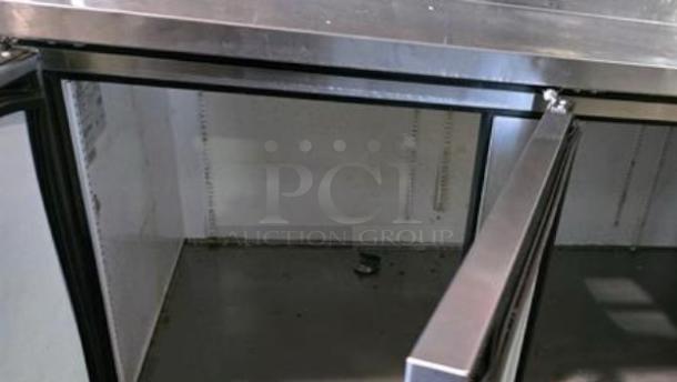 True TPP-93 3-Door Pizza Prep Table Refrigerator in excellent condition, open doors shown, stainless steel, 115V.