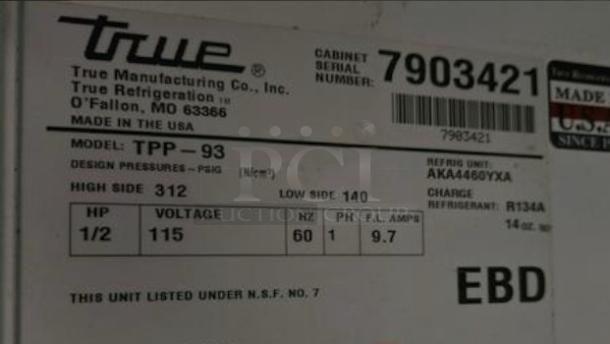 Label of True TPP-93 mega-top pizza prep table refrigerator showing model, voltage, and refrigerant details.