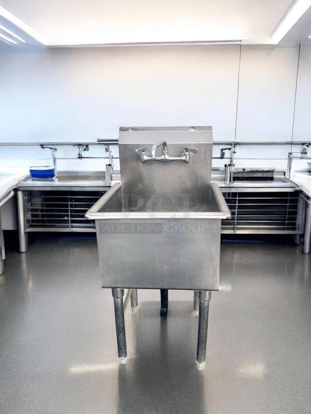 Commercial-grade stainless steel 3-compartment sink with dual drainboards, 98" wide, excellent condition, fully operational.