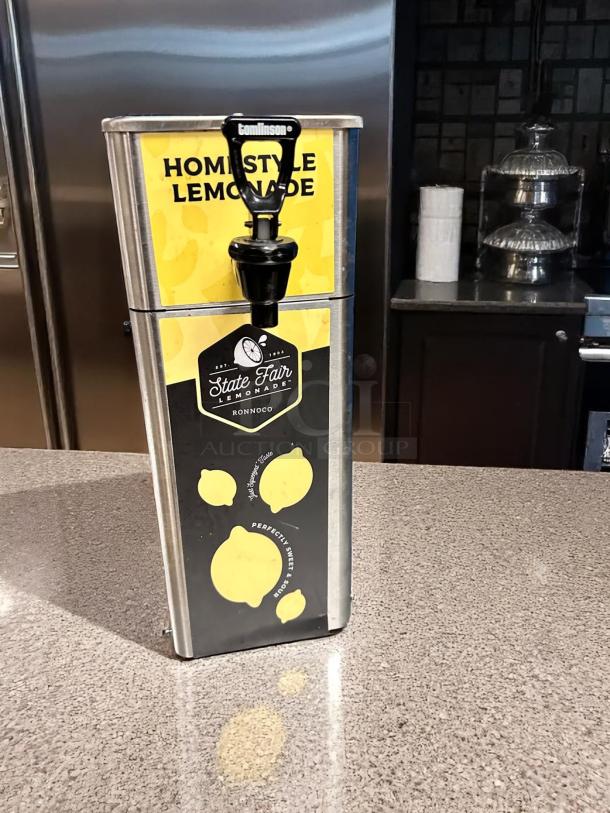 Newco FPM-1 stainless steel cold beverage dispenser with manual pour spout, excellent condition, fully tested, homestyle lemonade label.