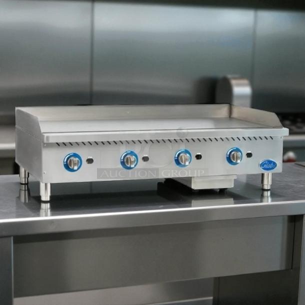 Globe GG48G 48" gas griddle with manual controls, 1" steel plate, tested and working, convertible design, excellent condition.