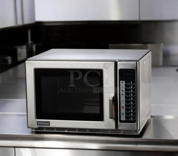 Amana RFS12MPSA commercial microwave oven, 1200W, 120V, excellent condition, fully tested, keypad controls, stainless steel.