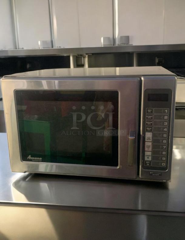 Amana RFS12MPSA commercial microwave oven in outstanding condition, 1200W, 120V, fully tested and working, with keypad controls.