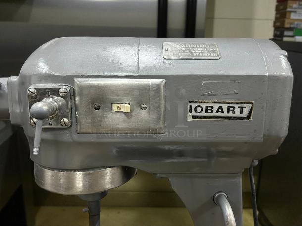 Hobart A200 20 QT dough mixer in excellent condition, with 115V single phase, tested and working. Visible controls and warning label.
