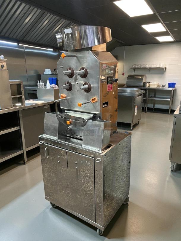 Citrocasa 8000 SB-ATS Advance citrus juicer with base, fair condition, sold as-is, visible patent label, stainless steel exterior.