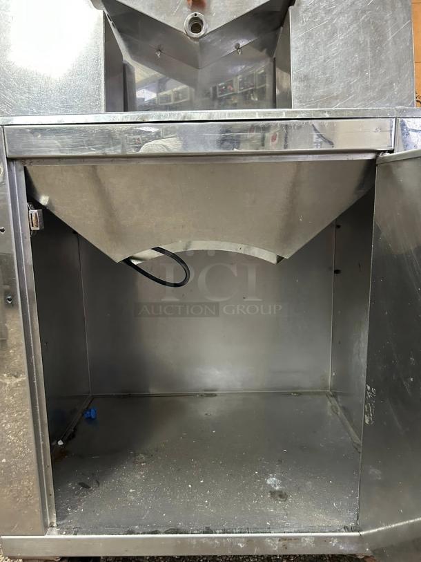 Citrocasa 8000 SB-ATS Advance Citrus Juicer with base, stainless steel, visible wear, sold as-is.