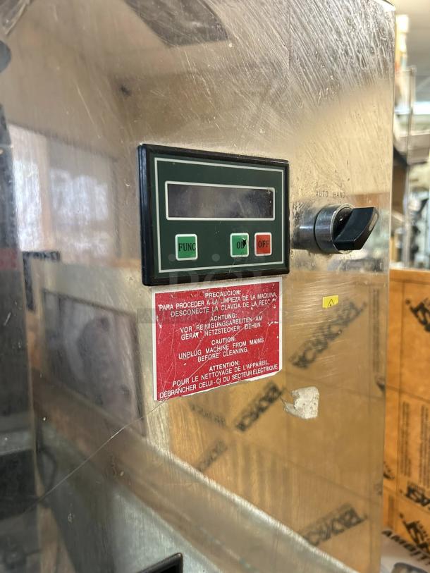 Citrocasa 8000 SB-ATS Advance Citrus Juicer with base, showing control panel and caution label. Sold as is.