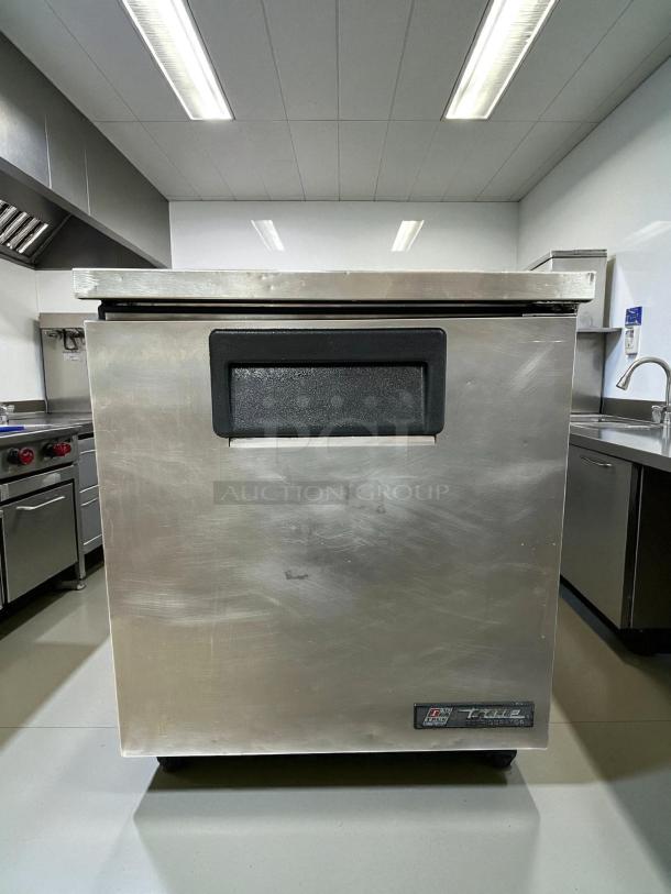 True TUC-27-HC-LP undercounter refrigerator, stainless steel, excellent condition, tested working, visible True logo.