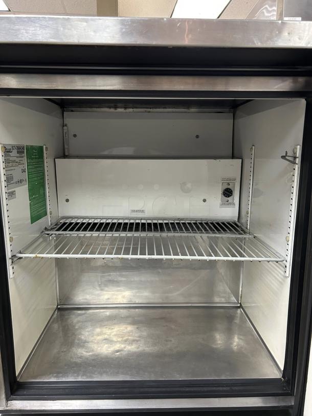 True TUC-27-HC-LP undercounter refrigerator in excellent condition, single section and door, tested and working, interior view.