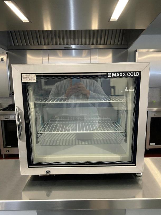Maxx Cold MXM1-2FHC countertop glass door merchandiser freezer, like new, stainless finish, visible internal shelving.