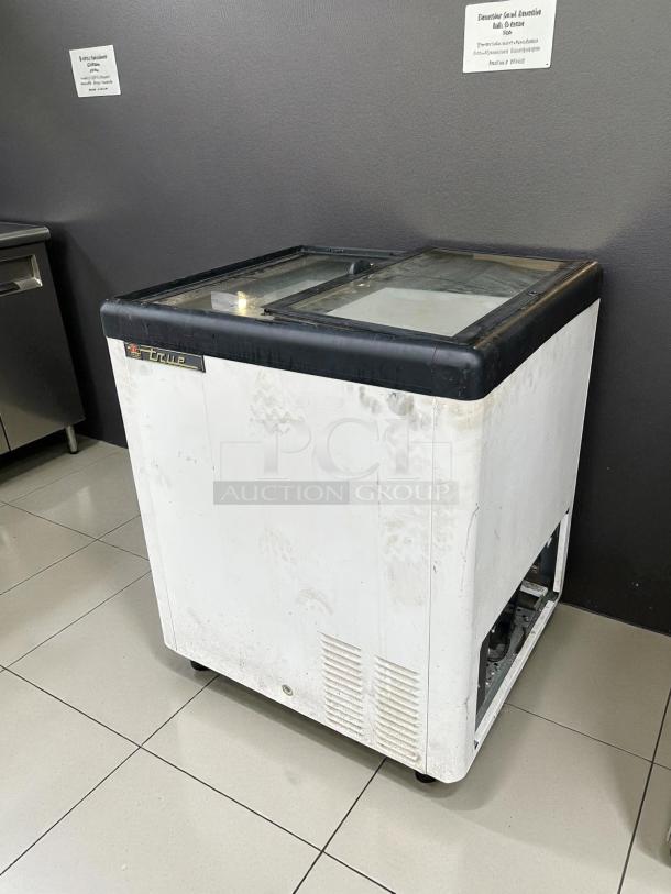 True THM-29FL chest freezer, 6.3 cu.ft., flat lid, sliding glass top, tested and working, 115 volts, used condition.