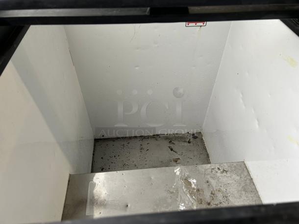 True THM-29FL chest freezer, 6.3 cu.ft., flat lid, sliding glass top, used condition, visible signs of wear, 115 volts.