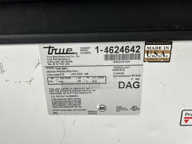 Label for True THM-29FL chest freezer, model info, serial number, voltage 115, refrigerant R134A, made in USA, NSF listed.