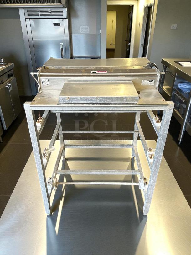 Heat Seal 104A floor wrapping machine, triple 20" roll, stainless steel, 725W, 115V, tested and working, great condition.