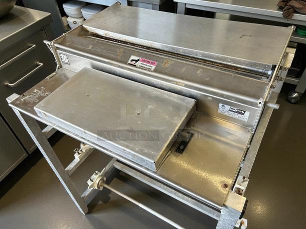 Heat Seal 104A Triple 20" Roll Film Wrapping Machine, 725W, 115V, stainless steel, great condition, tested and working.