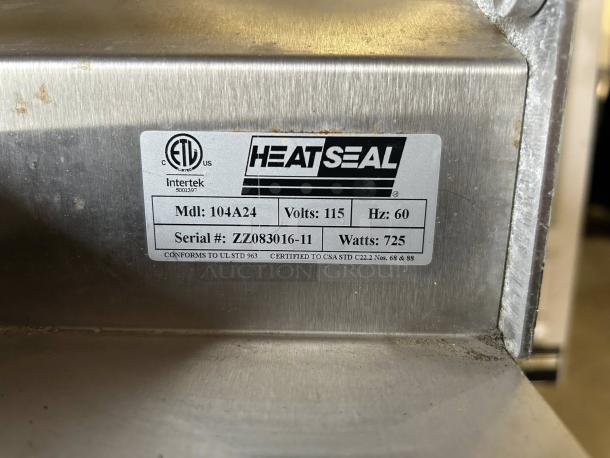 Heat Seal 104A wrapping machine label, 115V, 725W, tested working condition. Serial #ZZ083016-11, UL and CSA certified.