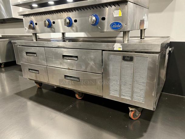 Delfield F2962CP 62 1/4" chef base with four drawers, stainless steel, tested working, visible wear, on wheels.