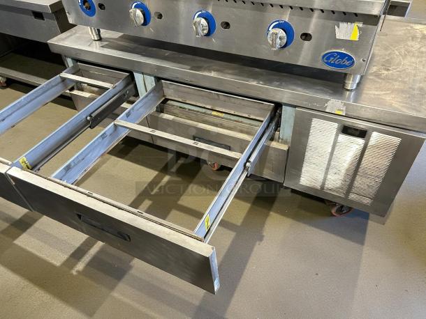 Delfield F2962CP 62" chef base with 4 drawers in stainless steel. Tested, working condition with visible brand label.