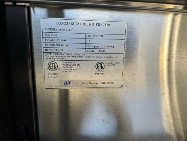 Turbo Air TOM-50LB-N label showing model, ratings, refrigerant info, certification marks, and serial number.