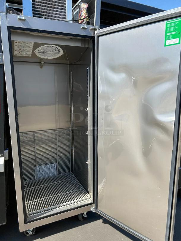 Turbo Air EF24-1-N-V 28" reach-in freezer, top mount, 22 cu. ft., like new, solid door, interior shelves visible.