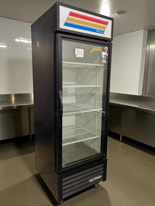 True GDM-23-HC~TSL01 glass door merchandiser, black, 27", right hinge, excellent condition, 115v, tested and working.