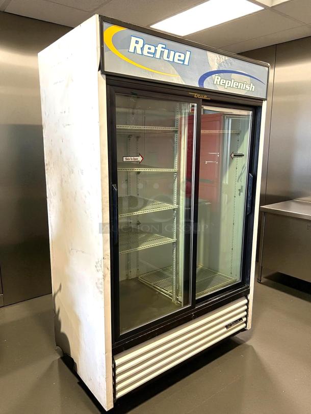 True GDM-45-HC-LD glass door merchandiser, black, two sliding doors, tested and working, "Refuel" branding, 51 1/8".