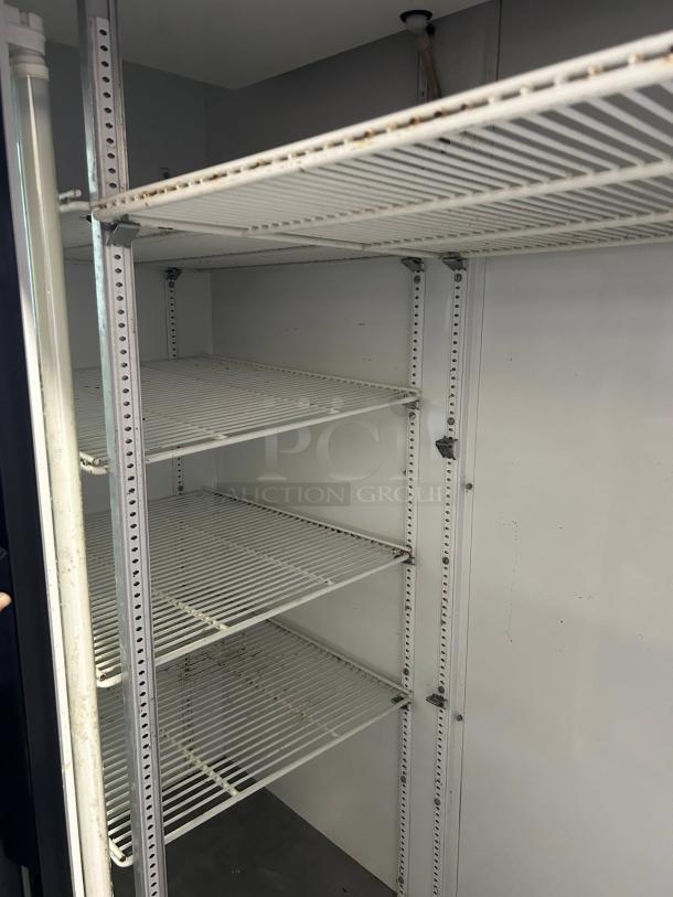 True GDM-45-HC-LD merchandiser, two sliding glass doors, black finish, adjustable shelves, signs of use, tested, working.