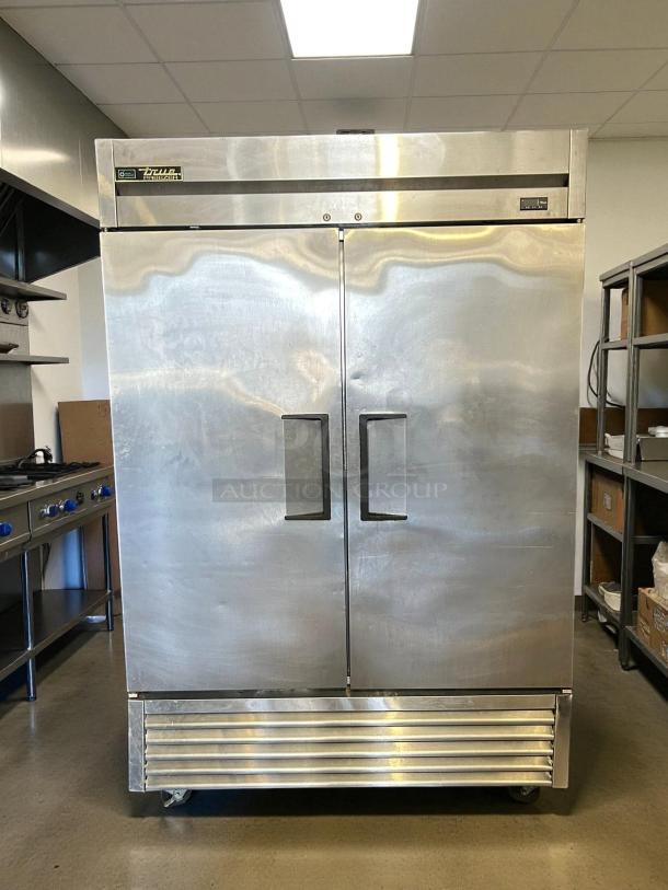 True T-49F-HC two-section reach-in freezer with solid doors, 54 1/8", excellent condition, tested and working.