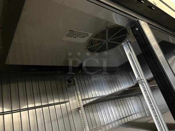 True T-49F-HC reach-in freezer interior, excellent condition, shelves and fan visible. Tested, 115v.