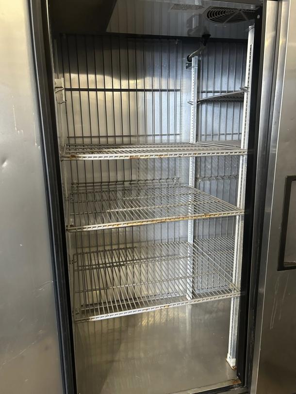 True T-49F-HC 54" reach-in freezer, dual solid doors open, interior view, excellent condition, tested, 115v.
