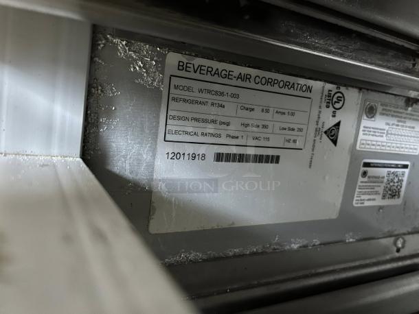 Beverage Air WTRCS36HC label showing model, refrigerant, design pressure, and electrical ratings, in working condition.