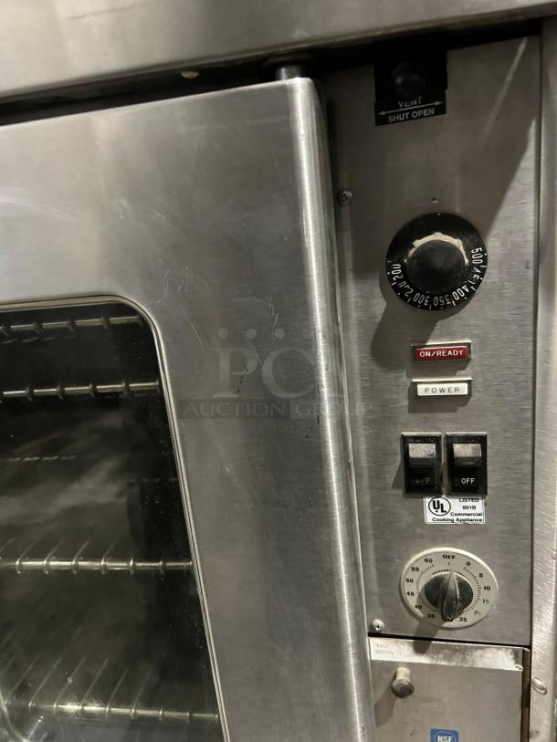 Montague 2EK12A double-deck electric convection oven with thermostatic controls, visible dials, and power switches, in good condition.