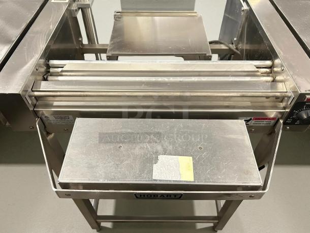 Hobart HWS-4-C wrap station with hotplate, dual film roll capacity, stainless steel, tested, working, 120v, excellent condition.