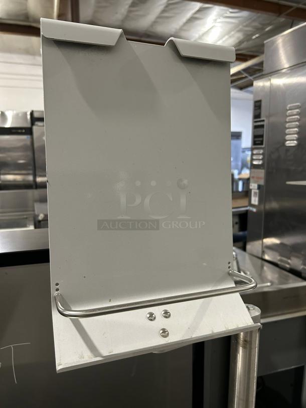 Hobart HWS-4-C floor model wrap station with built-in hotplate, dual film roll capacity. Tested and working, 120v power.