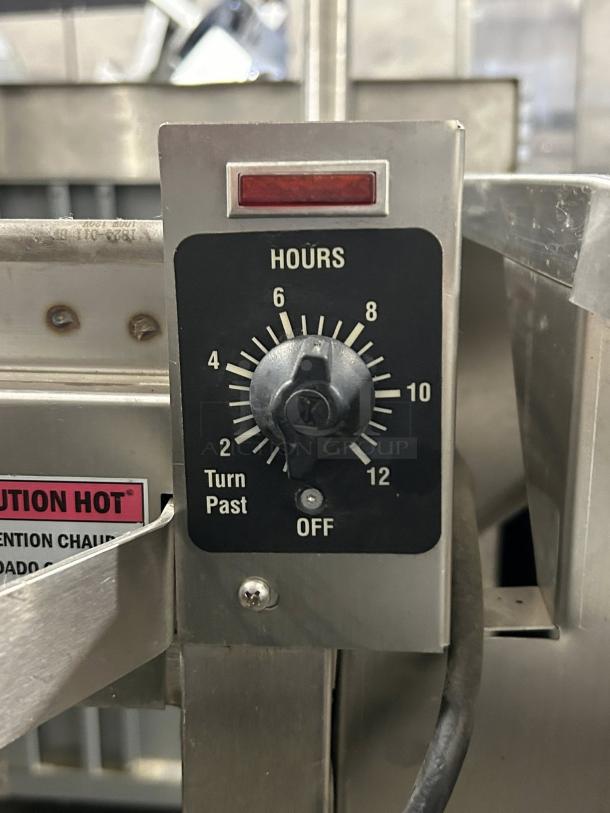 Hobart HWS-4-C Wrap Station timer control panel, showing hour settings and caution hot label. Appears in functional condition.