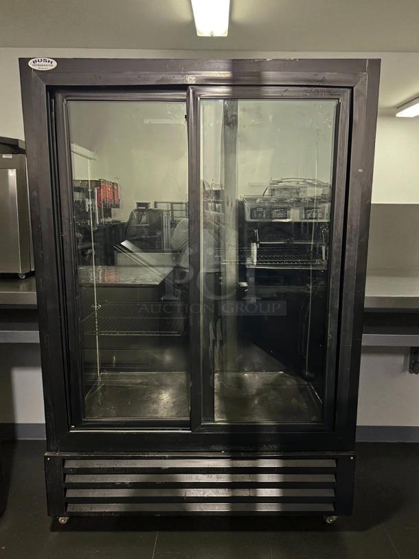 Bush Refrigeration FS52GDHC sliding door refrigerator, black, tested and working, glass doors, visible brand label at top.