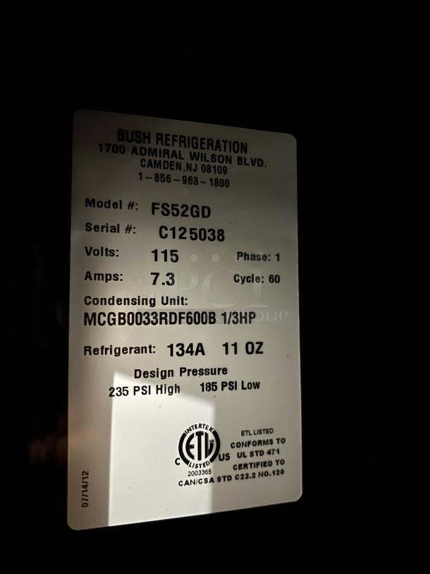 Bush Refrigeration FS52GDHC label showing model, serial number C125038, voltage 115, phase 1, and refrigerant 134A.