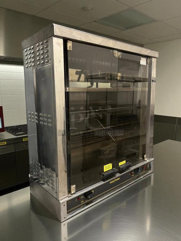 Robot Coupe electric countertop chicken rotisserie, 220v, 1ph, stainless steel, tested and working, front control panel visible.