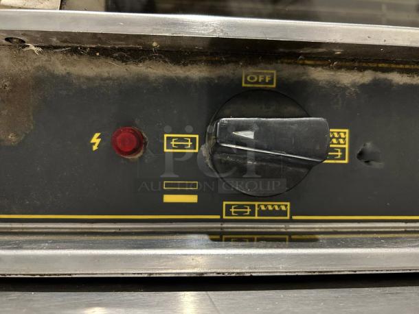 Robot Coupe electric countertop chicken rotisserie, 220V, 1ph control panel. Features power knob and indicator lights. Tested and working.