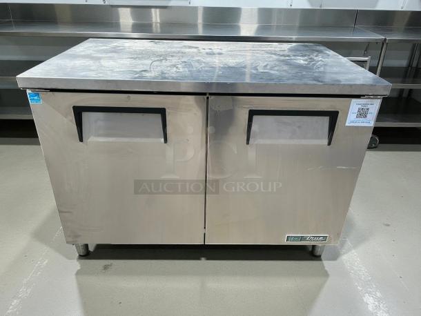 True TUC-48-HC 48" undercounter refrigerator, like new, stainless steel, two sections with two doors, 115v. Model label visible.