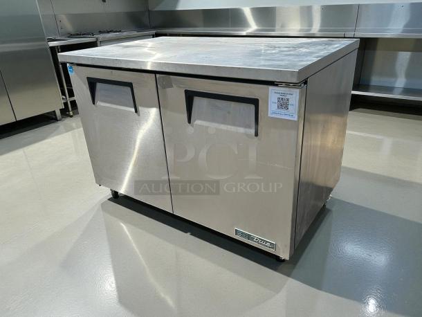 Like new True TUC-48-HC undercounter refrigerator, 48" wide, stainless steel, two sections, and two doors, 115v.