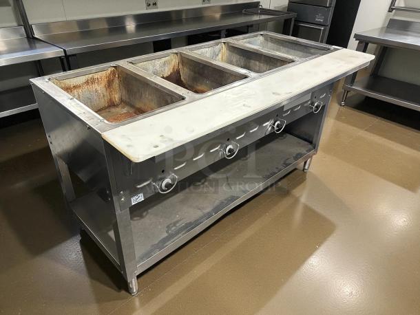 Duke 304 4-well Aerohot Steamtable, stainless steel, natural gas, 55-3/8", great condition, tested and working.