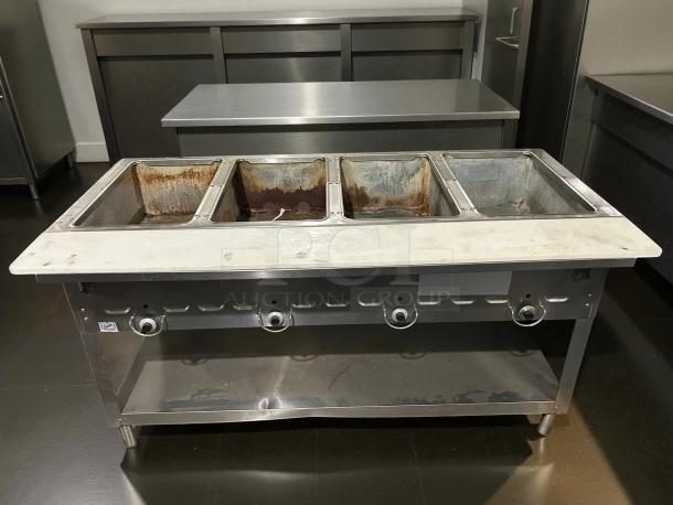 Duke 304 4-Well Aerohot Steamtable, 55-3/8", natural gas, tested, great condition. Four compartments, stainless steel.