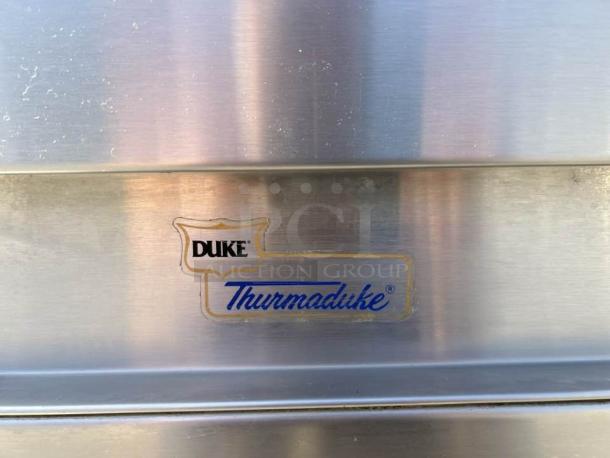 Duke E304 hot food table label, stainless steel finish, "Thurmaduke" branding visible, in working condition.