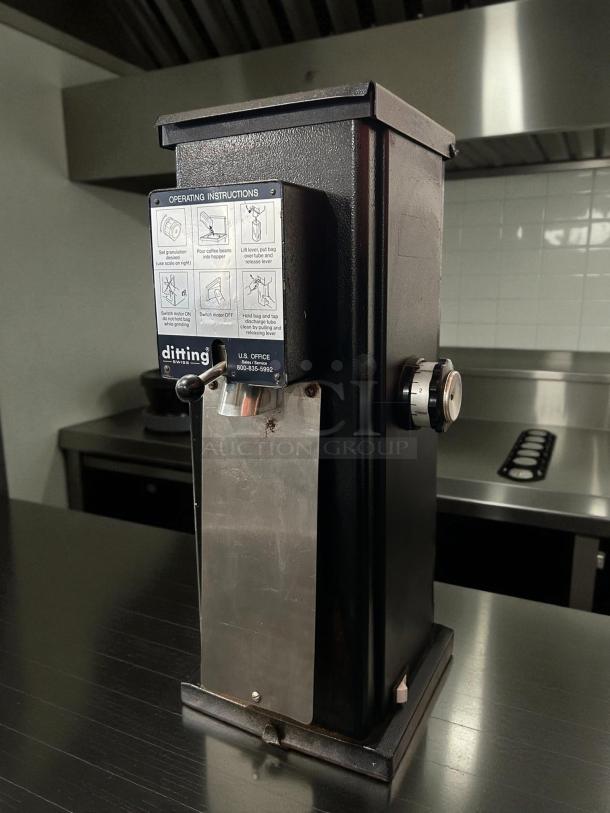 Ditting KR1403 commercial coffee grinder in great condition. Black, sleek design, clear operating instructions visible. Tested and working.