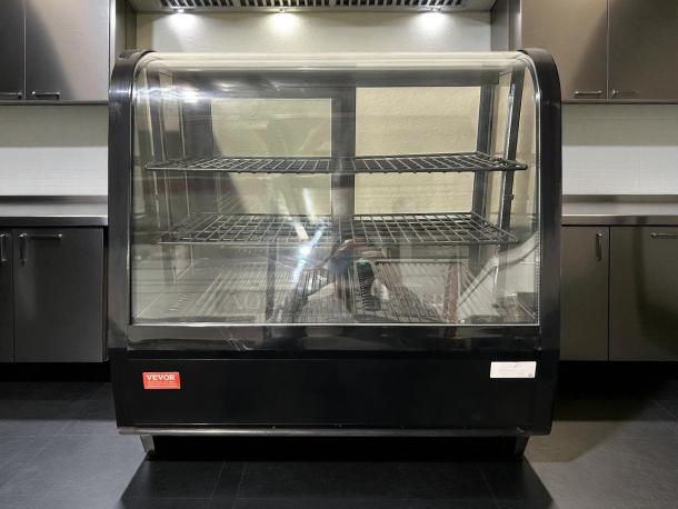VEVOR XCW-100L refrigerated display case in excellent condition, 4.2 Cu.Ft., 2-tier, clear glass front, black exterior.