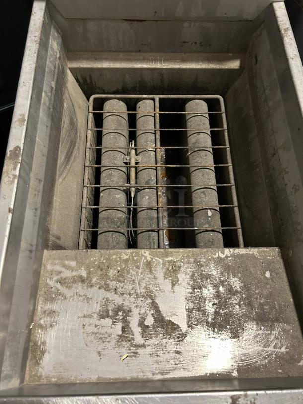 Vulcan LG300-NG natural gas floor fryer, excellent condition, 35-40 lb capacity, tested and working, interior view shows heating elements.